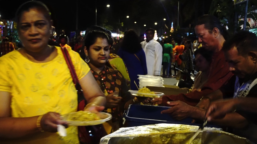 Georgetown, Penang / Malaysia - Feb 07 2020: Volunteers give free food to devotees during Thaipusam. | Shutterstock HD Video #1051760176