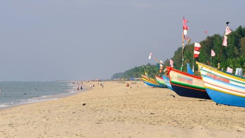Traditional fishing boats on the famous Marari beach in Kerala state, India 