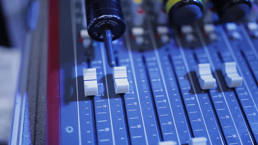Faders remote sound engineering. Mixer control of the sound engineer standing on the table at a public event. | Shutterstock HD Video #1051766956