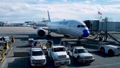 Denver, CO / USA - 5/1/20: A UA 787 Dreamliner wears a face mask over the nose of the aircraft. United was the first US airline to require crew to wear masks on 4/24/20. Passengers required as of 5/4