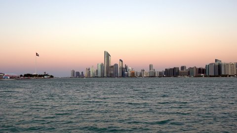 View modern city architecture and skyscrapers - Abu Dhabi skyline and beach at sunset | UAE | Corniche