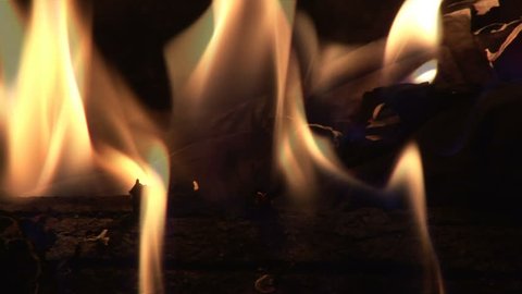 Closeup of a burning log in the fireplace. 