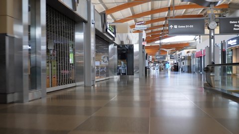 Raleigh, NC / USA - 5/2/20: Hyperlapse through the nearly empty RDU international airport during the coronavirus pandemic. Closed shops and empty walkways