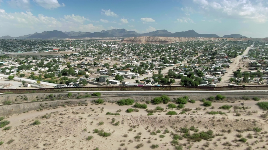 Aerial: El Paso border wall from the USA side that separates Mexico & the USA. 