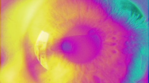 Psychedelic Eyesight Glitch Zoom Loop. Extreme close up of an wide opened eye in a psychedelic effect. Loop Ready