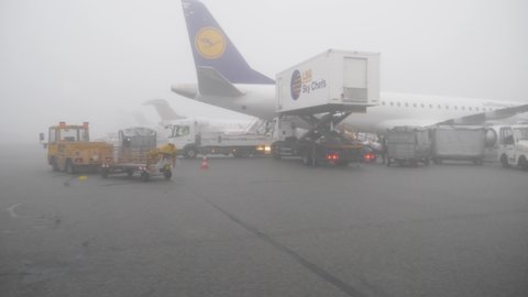 Munich airport, Germany - May 2020 - Lufthansa plane preparing for flight in fog