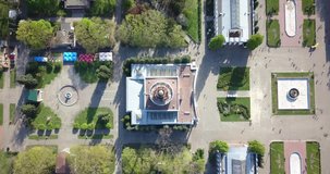 Aerial shooting with a drone from a bird's eye view on a summer sunny day, 4K high-resolution video. The top view of the symmetrical central avenue of the exhibition