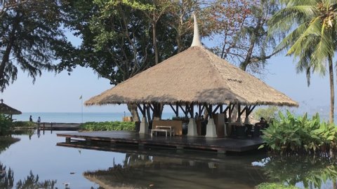 Krabi, Thailand - February 8 2018: The lush gardens next to the beachfront lounge of luxury hotel Phulay Bay, a Ritz Carlton Reserve resort