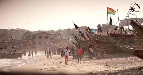 Winneba / Ghana - February 13 2020 : Unidentified people on the beach in Winneba near Accra in Ghana in West Africa