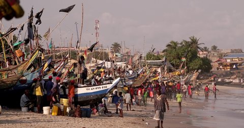 Winneba / Ghana - February 13 2020 : Unidentified people on the beach in Winneba near Accra in Ghana in West Africa