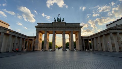 Empty Brandenburg Gate Establishing Shot in Berlin, Germany with No People at Golden Hour Sunset during Corona Virus COVID-19 Pandemic