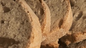 Rustic Sourdough Bread Slices in Detail - Macro 4K Video with Focus Pull of Homemade Crunchy Wheat Loaf From Traditional Recipe With Wild Yeast