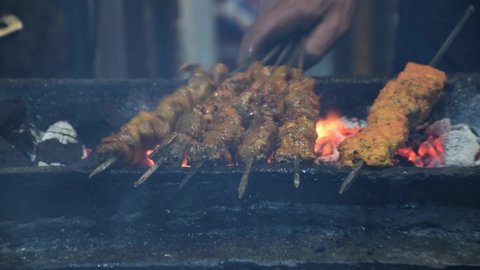 Indian non veg Food - Close Shot of mutton and chicken Kebab preparation in Progress . Seekh Kebab or Kabab