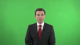 Newsreader in the Studio reading the news in front of a Green screen / Chroma key Background. Live Broadcast - Powered by Shutterstock - Get 15% off with code: PIKWIZARD15