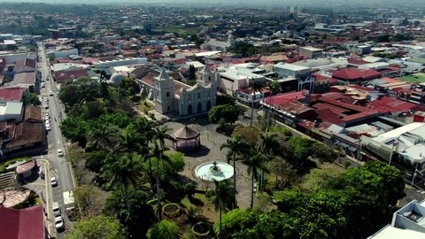 Beautiful cinematic aerial view of the empty streets of Heredia City and park in Costa Rica