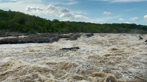 Great Falls is a series of rapids and waterfalls on the Potomac River, 14 miles upstream from Washington, D.C., on the border of Montgomery County, Maryland and Fairfax County, Virginia.