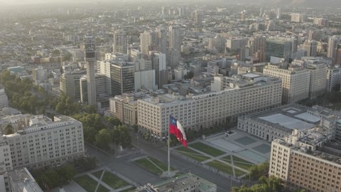SANTIAGO, CHILE - June 25, 2019 Aerial view of the Palacio la Moneda in the historic center of Santiago de Chile and the Chilean flag flying
