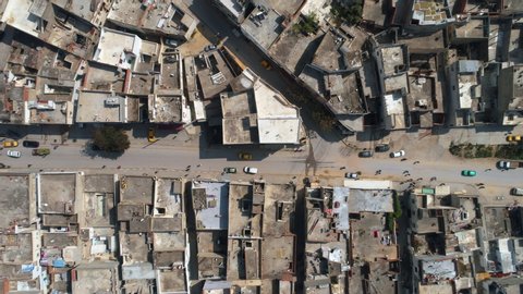 Aerial Drone View: Urban slums in the Capital of Tunisia - Tunis . Neighbourhood close to the City Center - Lake side, Tunisia from the sky