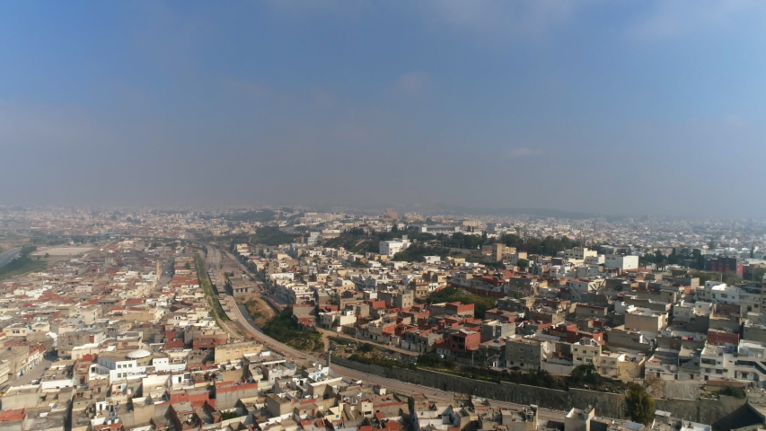 Aerial Drone View: Urban slums in the Capital of Tunisia - Tunis . Neighbourhood close to the City Center - Lake side, Tunisia from the sky | Shutterstock HD Video #1051855381