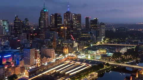 Melbourne, Victoria, Australia - December 25th 2019 - Melbourne City Skyline Night to Day with Hot Air Balloons Timelapse