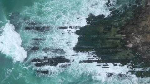 Amazing shot of the drone in the fall of Salalah, sea waves and rocks, Sultanate of Oman	
