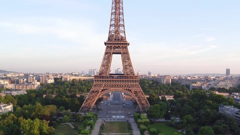 France, Paris, Tour Eiffel (Eiffel tower) champ de mars with La Defense and Trocadero background, at sunrise . 4k High Quality shot, aerial drone view.