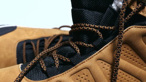 Fashion Brown Leather Shoes With Laces On A Wooden Floor Background Panning Slider Shot.