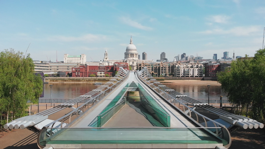 Drone shot Millenium bridge and St. Paul's Cathedral, almost nobody - 4K Royalty-Free Stock Footage #1051883188