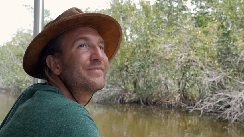 Tourist on boat exploring Everglades rivers, Florida