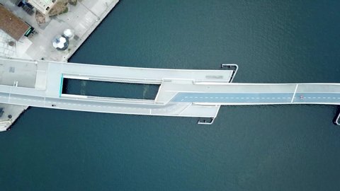 Copenhagen, Denmark - April 07, 2020: Aerial drone view of the new modern pedestrian and cycling bridge Inderhavnsbro.