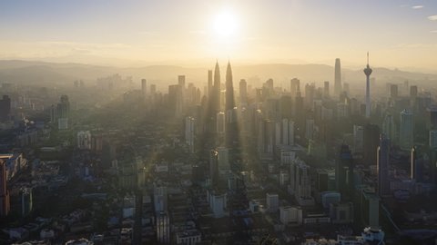 Cityscape Time lapse : Aerial Kuala Lumpur city view during morning overlooking the KL city skyline with beautiful ray of lights in Malaysia. Prores Full HD