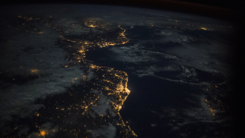 ISS Time-lapse Video of Earth seen from the International Space Station with dark sky and city lights at night over Europe, Time Lapse 4K. Images courtesy of NASA. Pan down motion timelapse Royalty-Free Stock Footage #1051898527