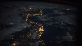 ISS Time-lapse Video of Earth seen from the International Space Station with dark sky and city lights at night over Europe, Time Lapse 4K. Images courtesy of NASA. Pan down motion timelapse