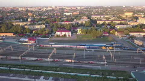 D-Cinelike. Russia, Omsk - July 16, 2018: The railway station of the city of Omsk. Trains on the railway ways, Aerial View