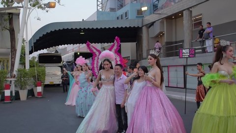 Pattaya - Thailand
20th March 2019
Ladyboys or transgender of a popular cabaret show calling local Thai People for getting photograph with themselves in lieu  of money in Pattaya City