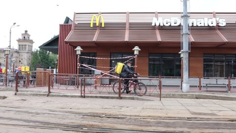 DNIPRO/UKRAINE 05.06.2020
McDonald's company provides fast food through express checkout. Mc drive. Work in quarantine mode. Residents of the city are waiting in line. Quarantine coronavirus