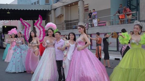 Pattaya - Thailand
20th March 2019
Beautiful Ladyboys of a popular cabaret show are taking photos with local thai people in exchange of money.