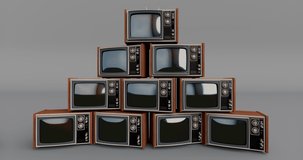 Pile of retro tvs with green screen turning on and off