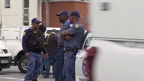 Cape Town , Western Cape / South Africa - 10 08 2018: SAPS and Cape Town Metro Police at crime scene