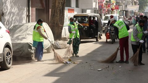 Jalandhar_Punjab_India_April_02_2020: Sanitization of streets and alleys in jalandhar city center due to the emergence of Coronavirus or Covid-19.
Road sweepers workers cleaning jalandhar city market 