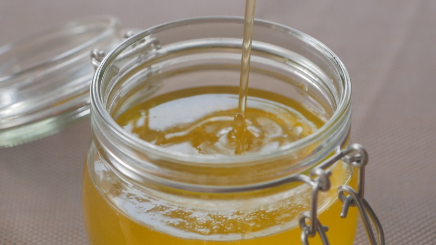 close pouring ghee melted butter into Stock Footage Video (100% Royalty ...