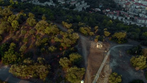Nice in France aerial 4K pull back reveal shot. Sunrise at Mont Boron in Nizza at French Riviera. Mont Alban fort drone footage with sea view