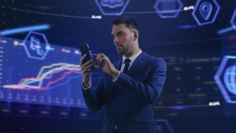 Virtual Reality Concept: Businessman Uses Smartphone in 3D World Surrounded by e-Business, e-Commerce, Stock Market, Infographics, Finance, Analysis, Charts, Graphs Icons. 360 Degree Tracking Arc Shot