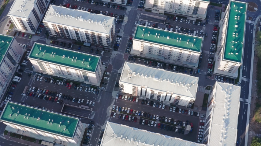 Residential block of high rise apartment buildings made of concrete in a big city in Europe - establishing shot. "Siti Kvart" in Podgorica Montenegro on a sunny morning. Aerial footage of a grid plan.