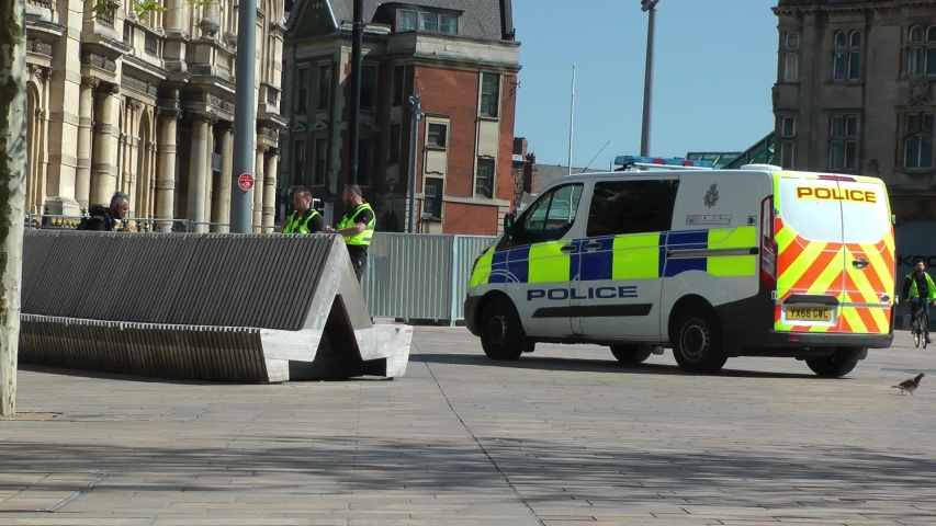 UK Police patrolling with a van in a city centre in lock down due to corona virus, covid 19 pandemic. Stay at home, protect NHS, save lives. Filmed Yorkshire, Engalnd, UK. 06/05/2020 | Shutterstock HD Video #1051971715