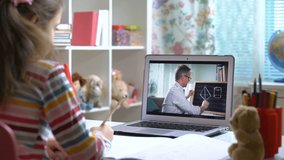 Middle-aged man distance teacher online tutor conferencing on laptop communicate with pupil by webcam video call e-learning. Home quarantine distance learning and working at home.