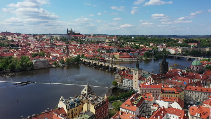Prague scenic spring aerial view of the Prague Old Town pier architecture and Charles Bridge over Vltava river in Prague, Czechia. Old Town of Prague, Czech Republic. | Shutterstock HD Video #1051979326