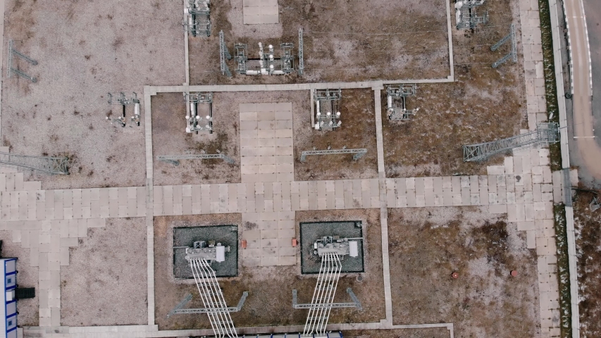 Aerial Drone View Electrical Power Substation. Circular orbit view, high voltage electric tower and hog voltage distribution cables. | Shutterstock HD Video #1051983898