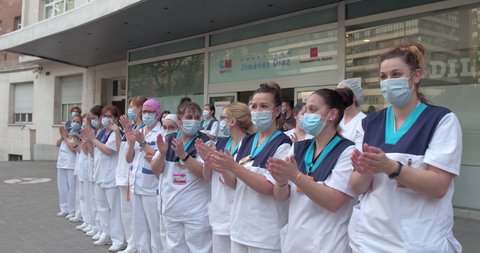 (traveling movement )medical personnel of the Fundación Jimenez Diaz Hospital in Madrid applauding the state of alarm in Spain for COVID-19. Filmed on May 7, 2020.