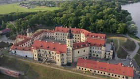 Flying over the Nesvizh castle, the Park around the castle and the lake, aerial video of Nesvizh
